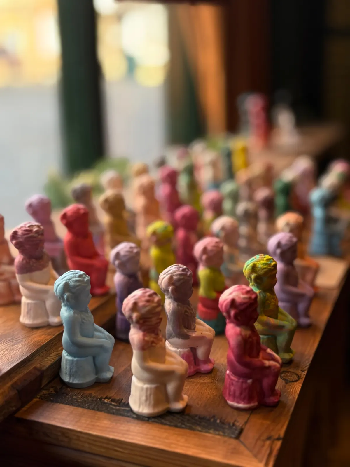 A colourful row of hand-painted Lincoln Imps