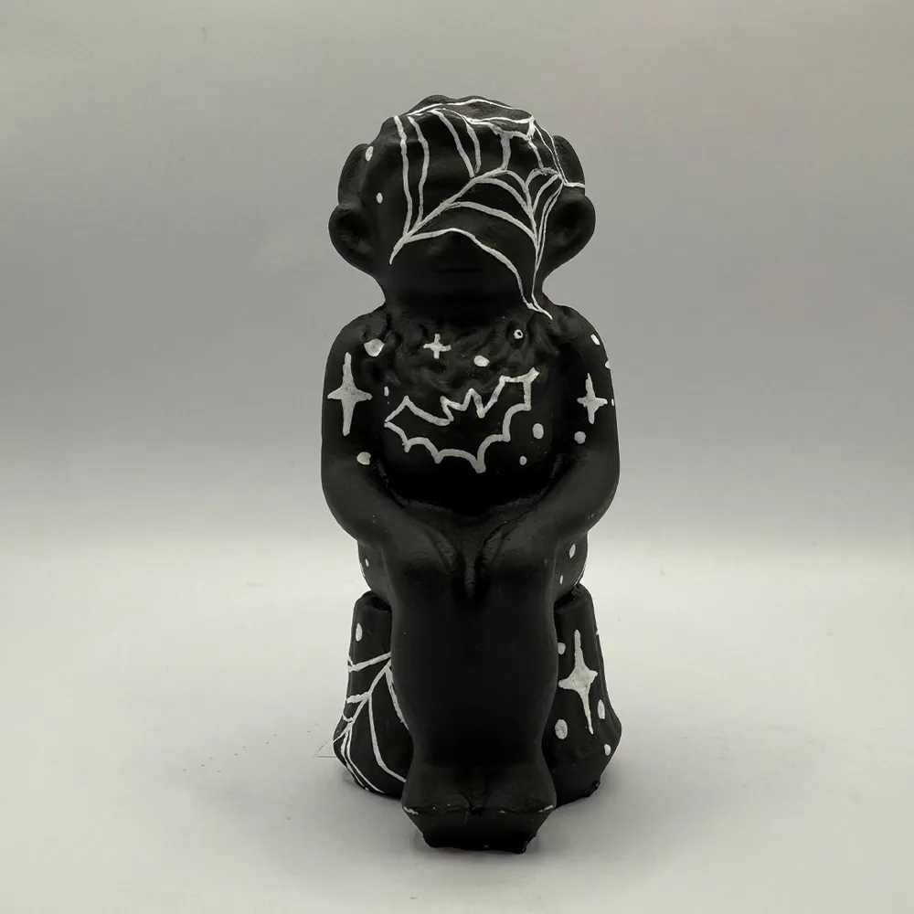 Caught in a Web, a Lincoln Imp painted by Meg Ferry