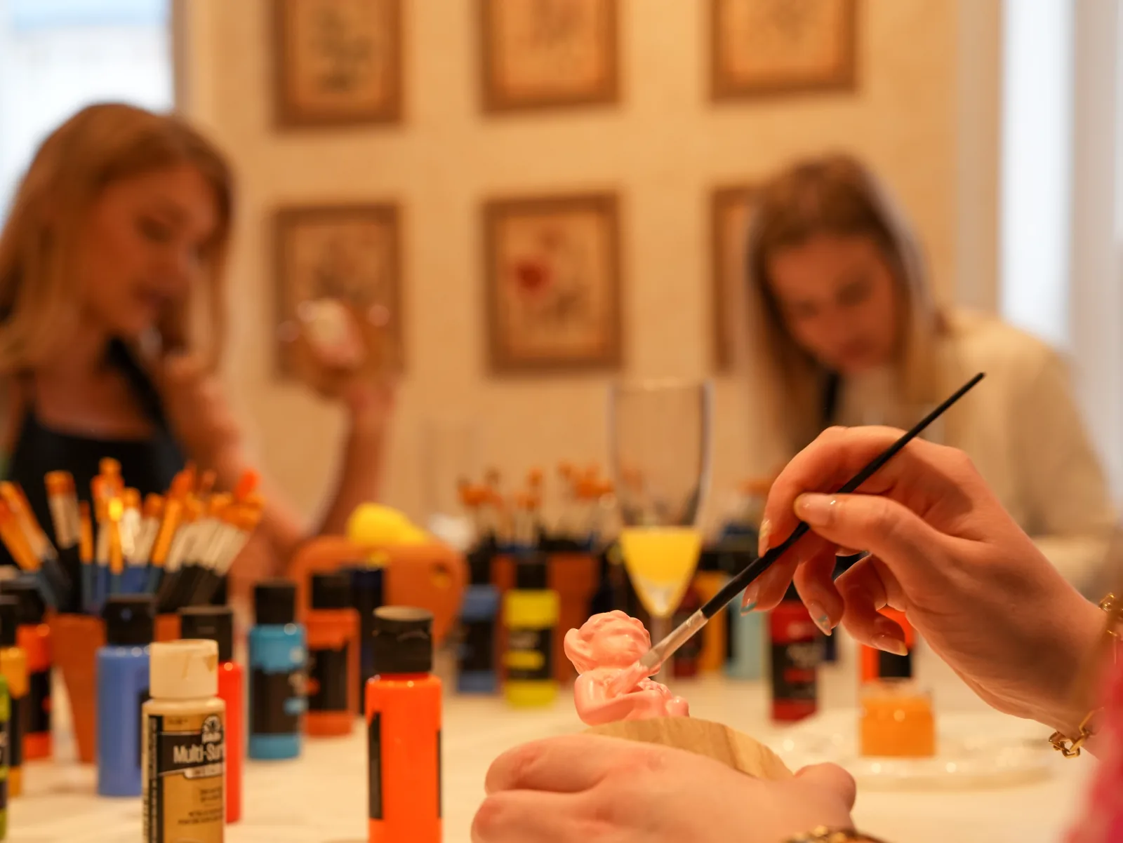 Guests adding fine detail to their Lincoln Imps at the workshop